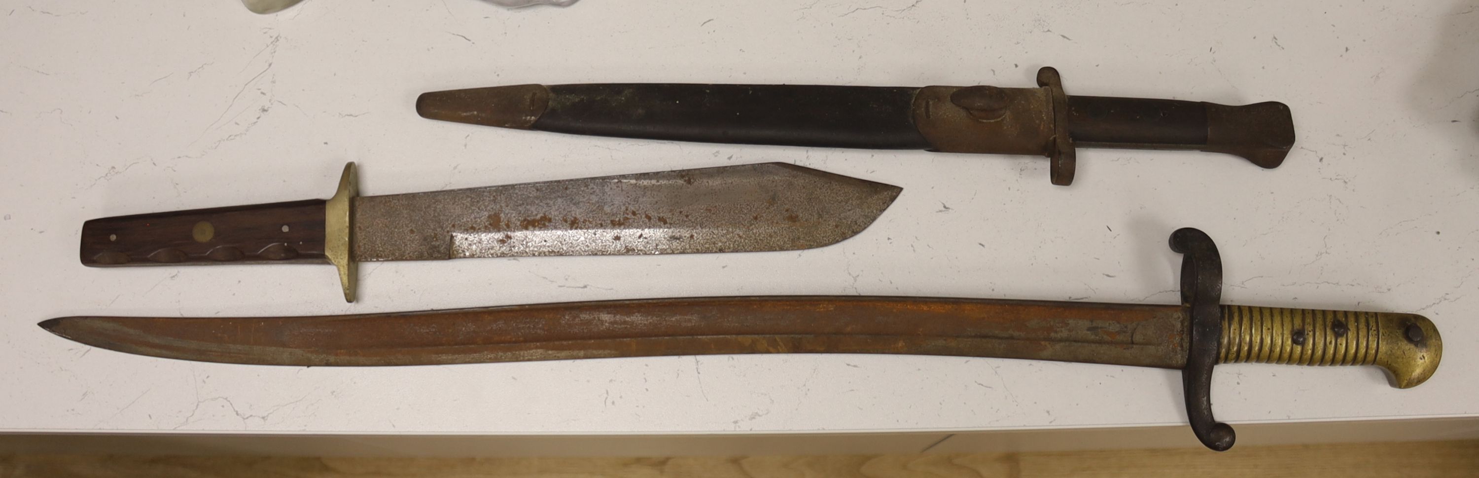 A 19th century French bayonet, together with an early 20th century English bayonet and a ‘Remember The Alamo 1836 The Stand of Colonel Jim' Bowie knife